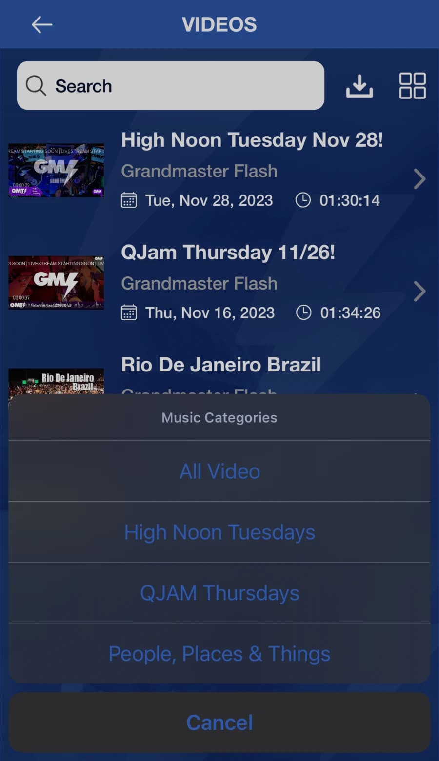 Grandmaster Flash iOS app — QMT VIP video archive with search, download, grid toggle and category filter (All Video, High Noon Tuesdays, QJAM Thursdays)